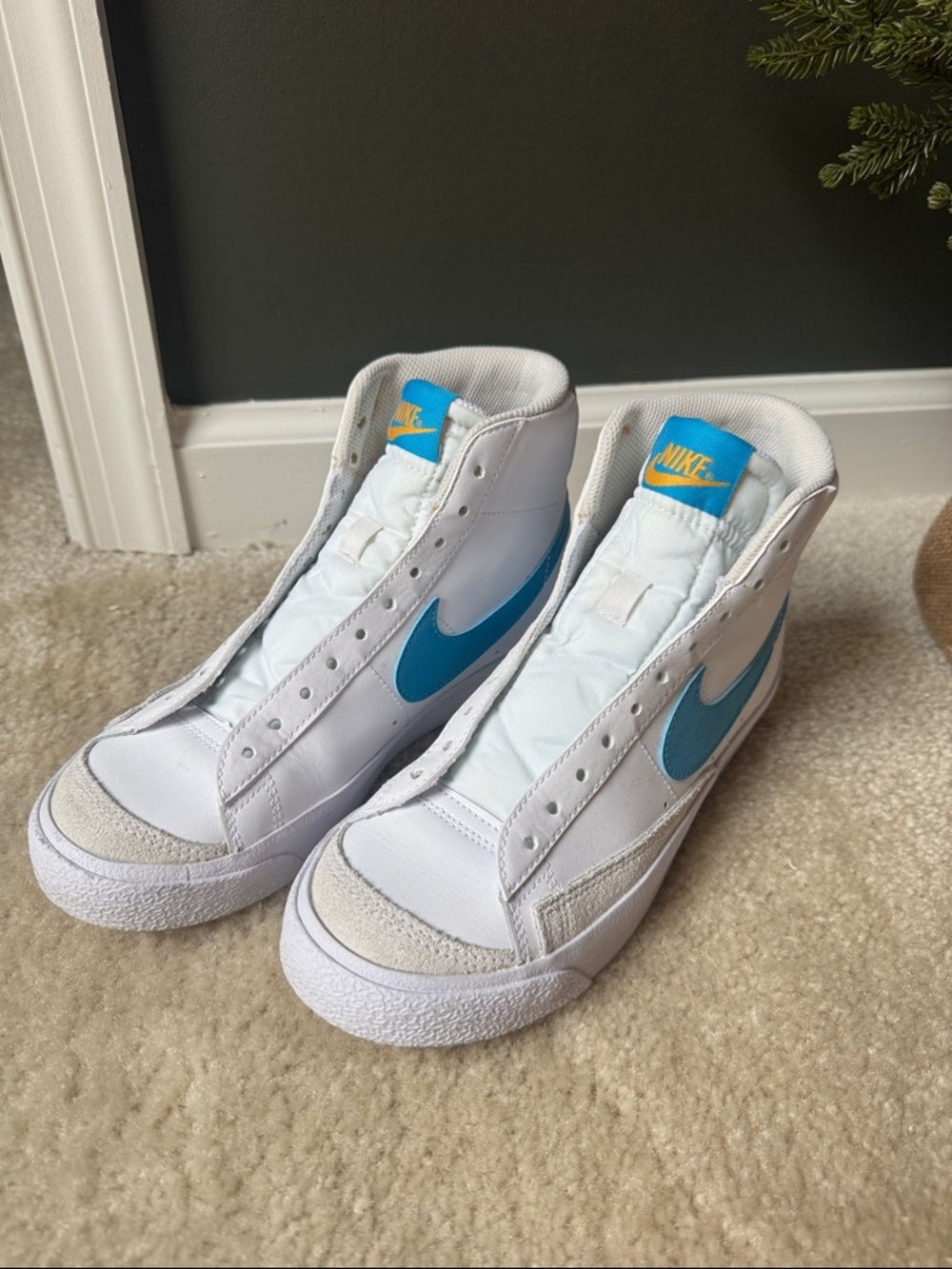 Nike White High-Top Sneakers with Blue Swoosh